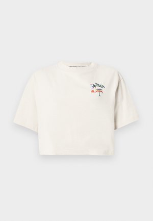 T-shirt crème à manches courtes et coupe courte en coton. Présente un graphisme coloré avec le texte « Volcom » et des motifs de pizza et d'arcs-en-ciel.