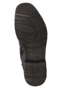 Semelle de chaussure en caoutchouc noir avec un motif texturé comprenant des rainures et un logo. La semelle est plate avec un bout et un talon légèrement arrondis.