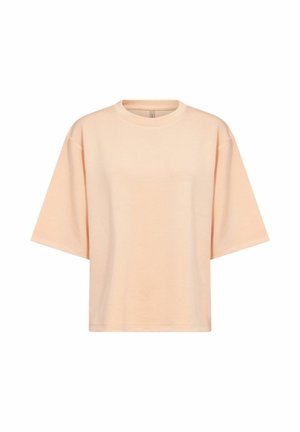 Maglietta oversize a maniche corte color pesca con scollo tondo, design semplice e cuciture delle spalle abbassate su sfondo bianco.