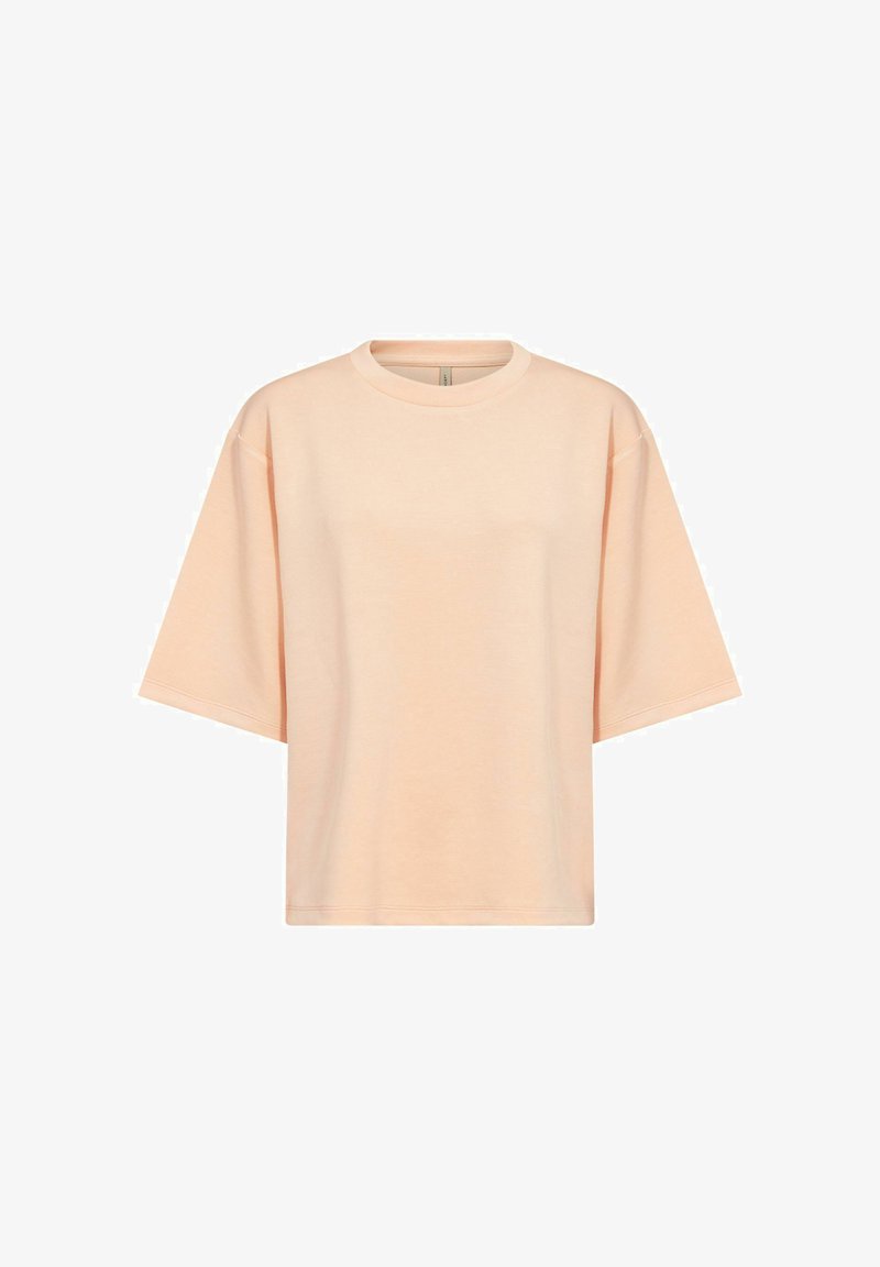 T-shirt oversize à manches courtes de couleur pêche avec col rond, design uni et coutures d'épaule tombantes sur fond blanc.