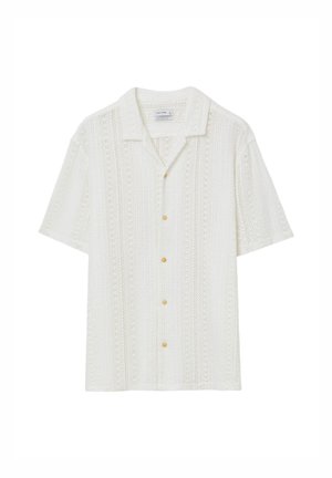 Camicia bianca a maniche corte con bottoni, caratterizzata da un motivo lavorato a maglia, due tasche frontali e bottoni in ottone. Design casual e traspirante.