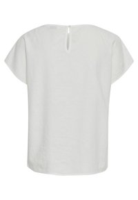 Weißes Leinenoberteil mit lockerem Schnitt, kurzen Kappenärmeln und einer Schlüsselloch-Detail am Rücken. Der Stoff hat eine weiche, leicht strukturierte Optik.