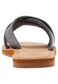 Gray leather slide sandals with two overlapping straps, soft beige suede insole, and a light brown rubber outsole.