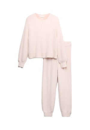 Gezellig twee-delig loungewear set in zachtroze. Bevat een verkorte, textuur gebreide trui met lange mouwen en bijpassende tappere broek met geribde boorden.