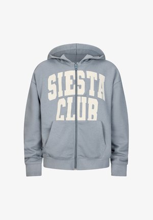 Sweat à capuche zippé bleu clair avec poche avant et texte blanc en gras "SIESTA CLUB" sur la poitrine, doté d'une capuche et de manches longues.