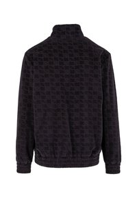 Veste noire à manches longues avec un col haut, motif checkered texturé, poignet élastique et taille élastique, vue de dos.