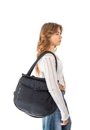 Black shoulder bag with a quilted texture and rounded shape. Features dual handles and a zippered closure. Logo displayed on front.