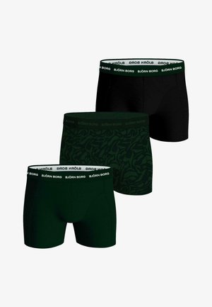 Tre par herrboxershorts i mörkgrön och svart, med en märkeselastisk midjeband. Ett par har ett lövmönster.