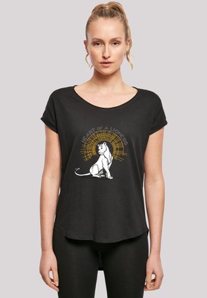 Black t-shirt with a relaxed fit, featuring a white lion graphic and the text "HEART OF A LIONESS" in gold above. Short sleeves.