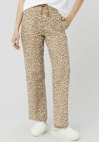 Pantalons en imprimé léopard dans des tons de brun clair et crème, dotés d'une taille élastique avec cordon de serrage. Tissu lisse avec une coupe décontractée.