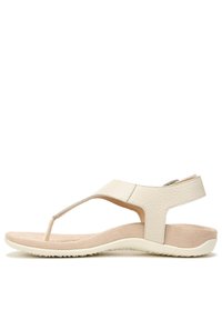 Light beige sandals with a textured leather upper, toe post design, and a cushioned insole; flexible rubber sole with a slight heel.