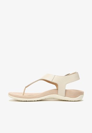 Light beige sandals with a textured leather upper, toe post design, and a cushioned insole; flexible rubber sole with a slight heel.