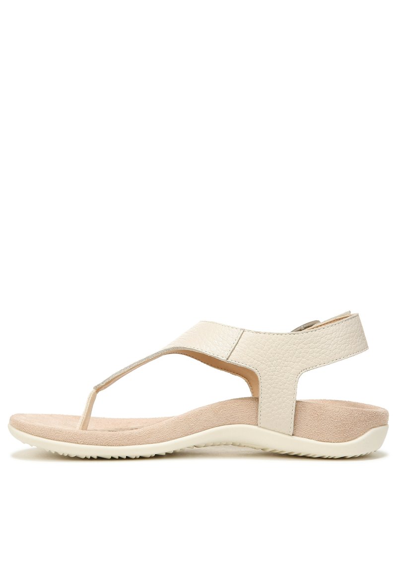 Light beige sandals with a textured leather upper, toe post design, and a cushioned insole; flexible rubber sole with a slight heel.
