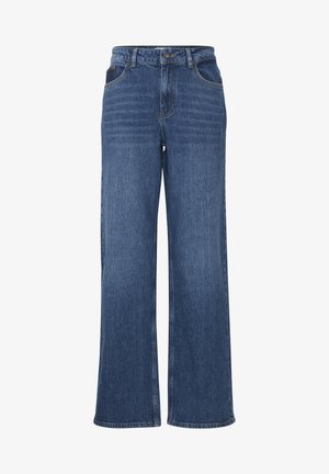 Sinine teksakangast laiad püksid kõrge vöökohaga, millel on ees taskud, vöörihmade augud ja õrnad tekstuuri varieerumised.