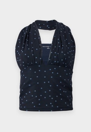 Τοπ halter σε ναυτικό μπλε με ανοιχτό μπλε πουά, με σούρες κάτω από το στήθος, με βαθύ V λαιμόκοψη και ραβδωτή υφή.