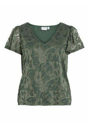 Haut en dentelle florale verte avec un décolleté en V, des manches courtes bouffantes et un motif texturé. La couche de base est lisse, mettant en valeur le motif floral.
