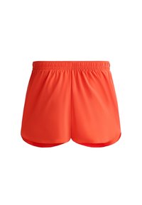 Jasnopomarańczowe spodenki sportowe z elastycznym paskiem i gładkim, lekkim materiałem. Charakteryzują się luźnym krojem i zaokrąglonym dołem.
