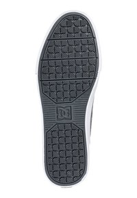 Black rubber sneaker sole with textured grip patterns, featuring a white edge and a logo in the center. Designed for traction and durability.