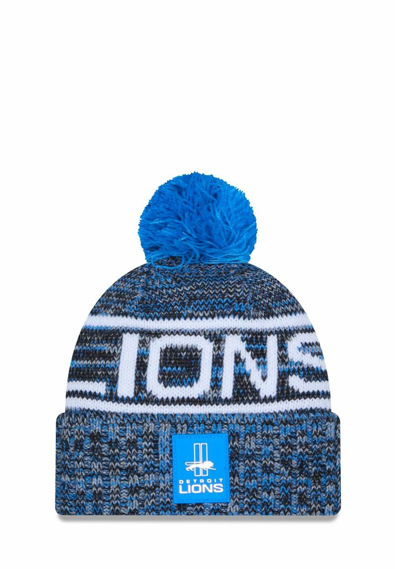 Gestreifte Mütze in Blau und Schwarz mit einem weißen "LIONS" Logo und einem blauen Bommel oben; besitzt ein strukturiertes Muster und ein quadratisches Etikett.