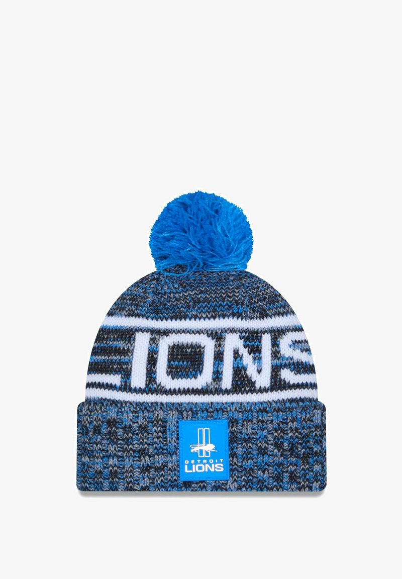Knit beanie in blue and black with a white "LIONS" logo and a blue pom-pom on top; features a textured pattern and a square tag.