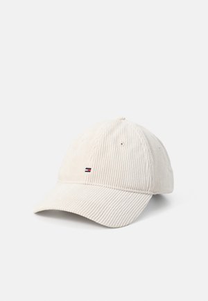 Beige corduroy baseball cap with a curved brim, featuring a small logo in red, white, and blue on the front left side.