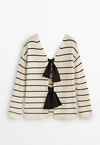 Beige randig tröja med svarta horisontella linjer, med en djup V-ringning och två svarta satinband fram. Mjuk stickad textur.