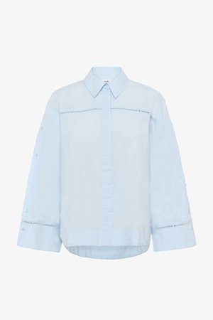 Light blue button-up shirt with a collar, long sleeves, and embroidered accents along the upper front and cuffs. Smooth fabric texture.