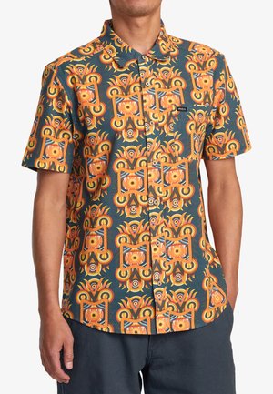 Short-sleeve button-up shirt with an orange and yellow abstract floral pattern on a dark teal background; lightweight fabric.