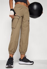 Under Armour UNSTOPPABLE - Püksid - bayou/black