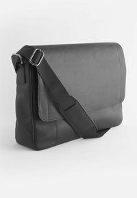 Black leather messenger bag with a textured finish, adjustable strap, and flap closure. Features a rectangular shape and minimal hardware accents.