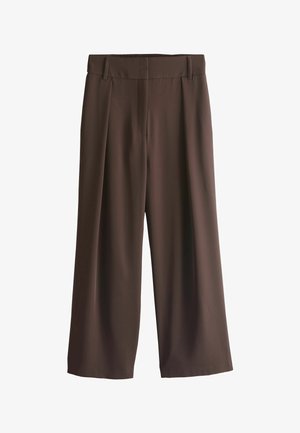 Brown wide-leg trousers with belt loops, front pleats, and a smooth fabric finish, displayed on a white background.