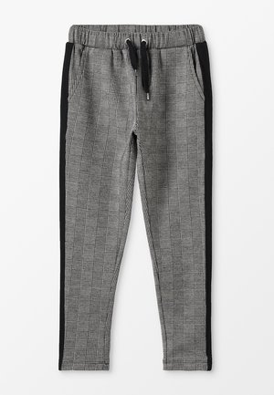 Szare i czarne spodnie w kratę z elastycznym pasem, sznurkiem i bocznymi kieszeniami, z czarnymi bocznymi panelami dla kontrastu.