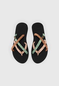 Black flip-flops with textured straps in green, pink, and brown, featuring a flat sole and minimalistic design.