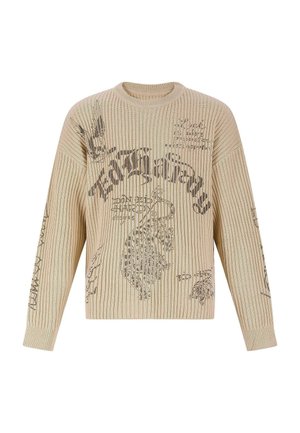 Suéter beige de canalé con mangas largas, que presenta texto impreso en negro y diseños gráficos. Cuello redondo con un ajuste holgado.