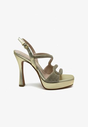 Sandale à talon haut dorée avec plateforme, bride de cheville avec boucle et brides avant et médianes décoratives ornées de strass.