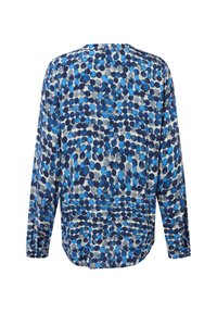 Blusa a maniche lunghe con motivo a pois circolari blu, navy e grigi su uno sfondo chiaro, mostrata dal retro.