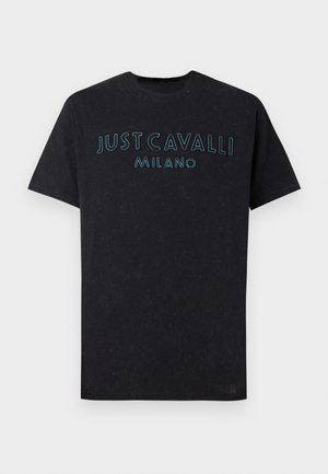 Black cotton t-shirt featuring "JUST CAVALLI MILANO" in bright blue embroidery across the chest, with a crew neckline and relaxed fit.