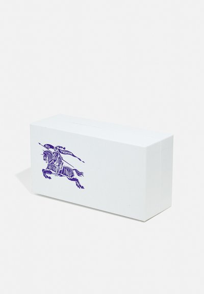 White rectangular box with a smooth texture, featuring a purple illustration of a horseman with a banner. Compact and minimalistic design.