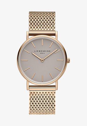 Guld mesh rem ur med en rund lys grå urskive, minimalistiske timemarkører og en sølvfarvet krone. Branding lyder "LIEBESKIND BERLIN."