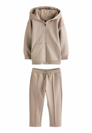 Lichtbeige zip-up hoodie met een kangoeroezak en elastische manchetten, gecombineerd met bijpassende joggerbroek met een elastische tailleband en zijzakken.