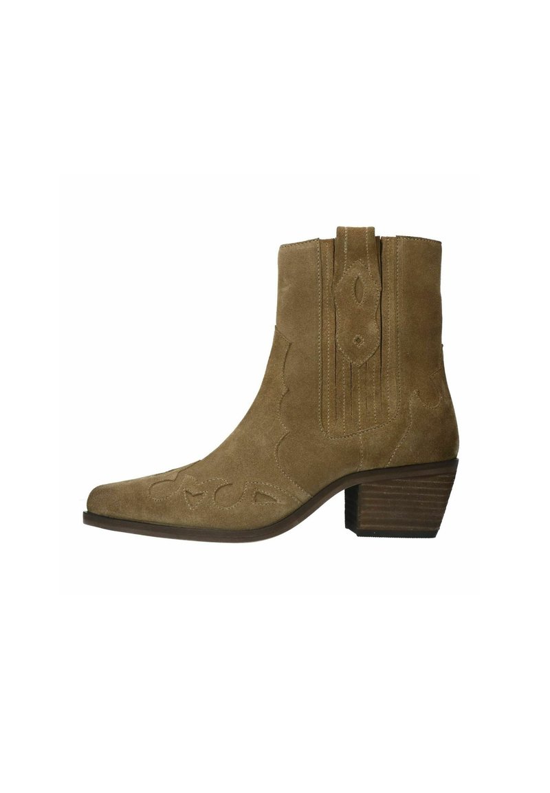 Brown suede ankle boot with pointed toe, scalloped stitching, and block heel. Features decorative cutouts on the toe area.