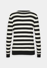 Pull rayé avec des rayures horizontales noires et blanches alternées, manches longues et col rond avec un ourlet et des poignets noirs unis.