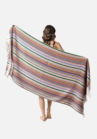 Striped blanket made of woven fabric, featuring vibrant colors like pink, red, and green, with fringed edges and a rectangular shape.