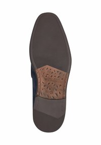 Dunkle Gummisohle mit strukturiertem grip. Verfügt über einen braunen Akzent mit eingraviertem Muster und Logo. Größe als 42 gekennzeichnet.