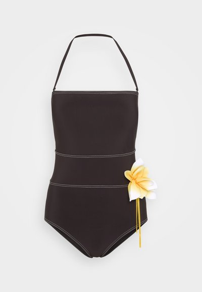 Mustmust, millel on kinnituskaelus, eristavate õmblustega ja külje peal kollaste ja valgete lilleaktsentidega. Sile kangastekstuuri.