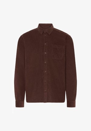 Brun cordflodsskjorta med långa ärmar, knapp-down krage, framficka och vertikal ribbad textur. Har bruna knappar längs fram.