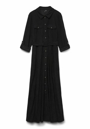 Mustmust pikkade varrukatega kleit, millel on kraekujuline kaelus, kolme nupuga mansetid, kaks rinnataskut, vöö ja esine nupu sulgemine. Pehme, tekstuuriga kangas.