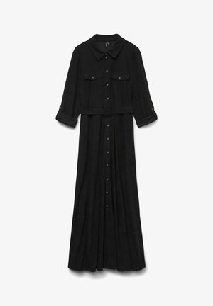 Juoda ilga rankovė su apykakle, trijų mygtukų rankogaliais, dviem krūtinės kišenėmis, liemens diržu ir priekiniais mygtukais. Minkšta, tekstūrinė medžiaga.