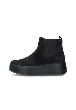 Stivaletti neri in suede con pannelli laterali elastici, punta rotonda e suola piatta spessa, caratterizzati da una finitura opaca liscia.