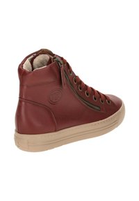 Red leather high-top sneaker with beige rubber sole, featuring side zipper, round toe, and textured detailing on the upper.